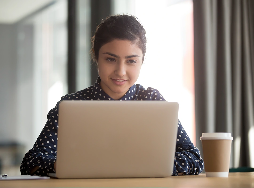 Woman sitting online learning Cognitive Behavioural Therapy